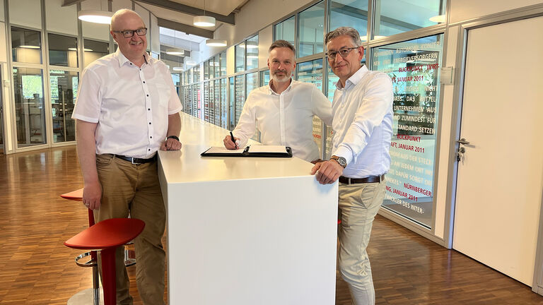 Photo of contract signing